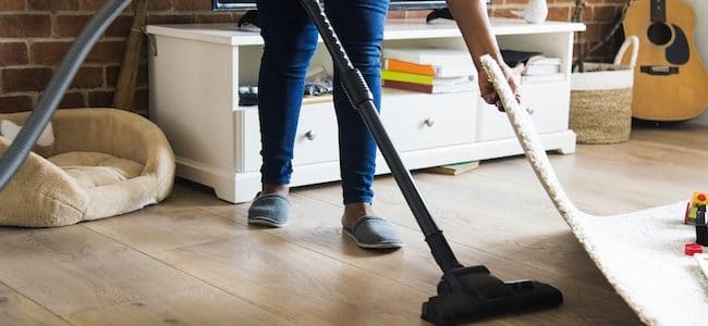 Cleaner vacuuming under carpet